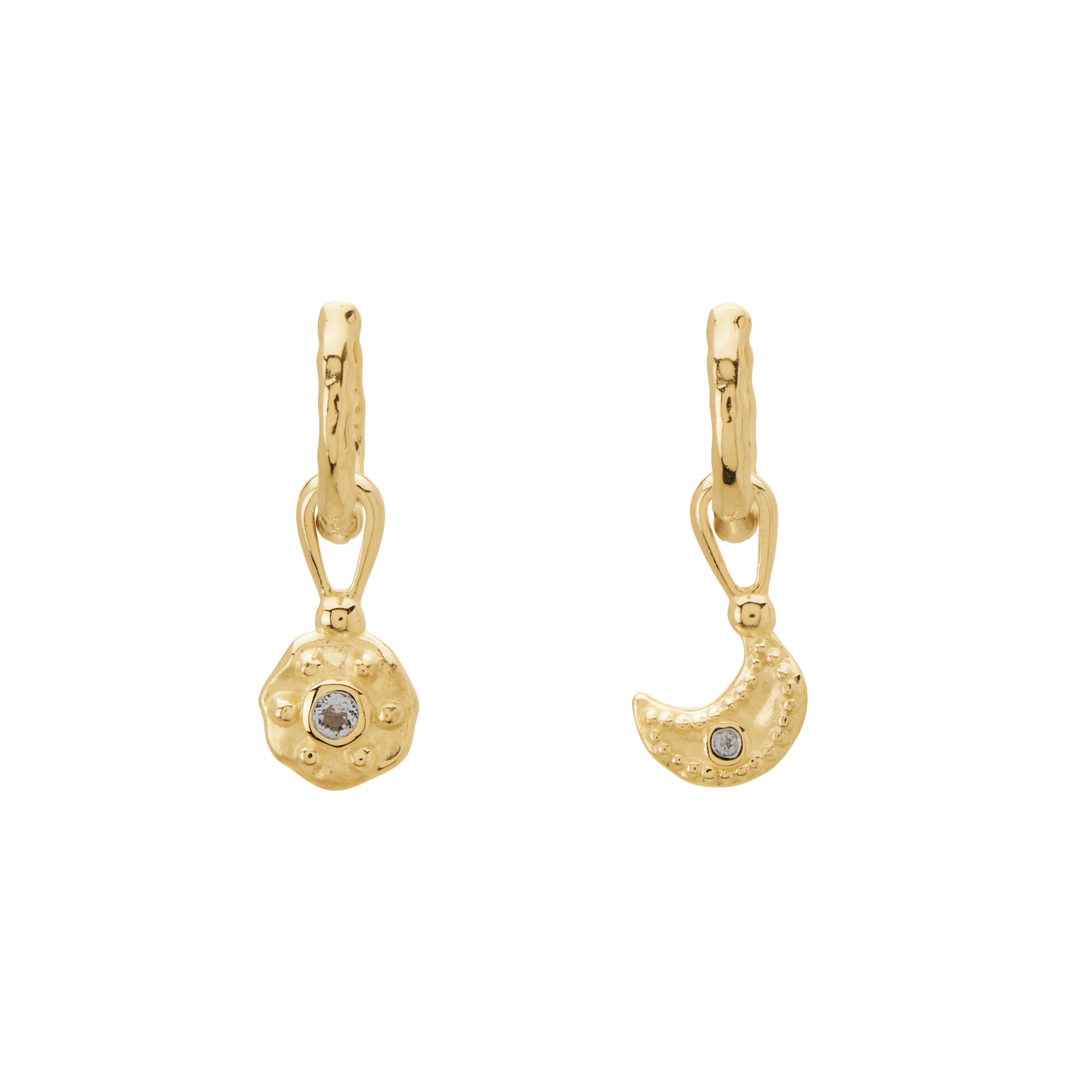 Gold earrings with circular and crescent moon designs on a white background